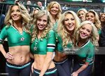 The Dallas Stars ice girls pose for a photo during a game ag