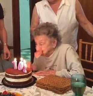 102 year old Louise Bonito blows out birthday candles but lo
