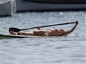 Josie Gibson seen paddleboarding whilst on holiday in Formen