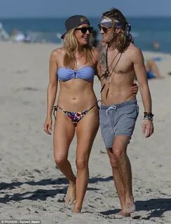 Ellie Goulding strolls with shirtless beau Dougie Poynter on
