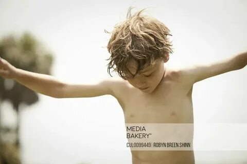 Mediabakery - Photo by Image Source - Bare-chested boy playi