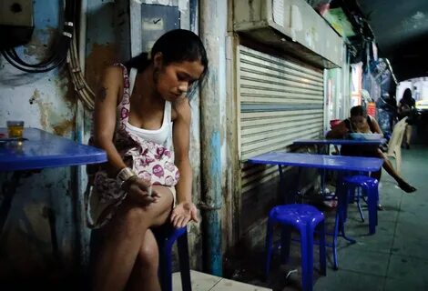 Backstreet girl A Prostitute in Bangkok, eating Isaan food. 