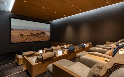 The downstairs movie theater provides an idyllic setting for in-home screen...
