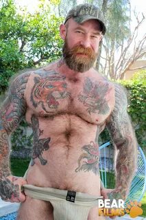 Jack Dixon shows his hairy muscled body and pierced dick