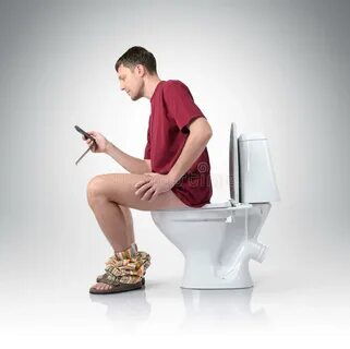 Man in Headphones Sitting on the Toilet. Yes! Stock Photo - 