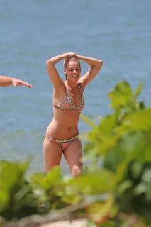 Margot Robbie topless sunbathing at the beach in Hawaii