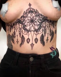 Dreamcatcher tattoo boob