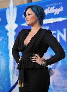 Demi Lovato braless showing big cleavage in a tight black ou