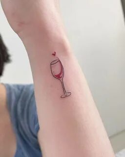 Fine line wine glass tattoo