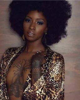 Afro boob tattoo