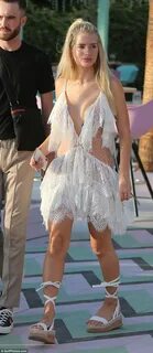 Lottie Moss flashes a peek of cleavage in plunging dress in 
