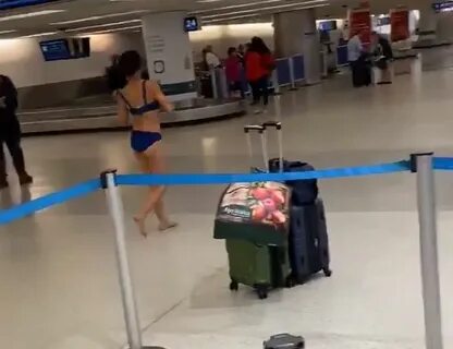 Naked Woman Wanders Miami Airport And Jumps On Police Car - 