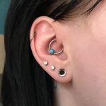 Ear stretching - fifth stretch 4mm / 6 gauge with a silver e