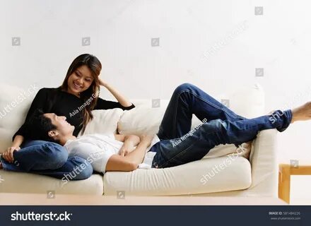 Couple On Sofa Man Lying On Stock Photo 581484226 Shuttersto