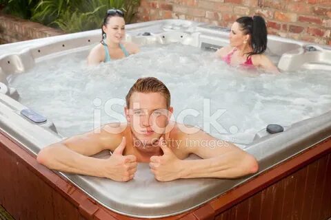 Young Man With Two Girls In Hot Tub Stock Photo Royalty-Free