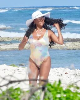 Vivica A. Fox Stuns In Silver Swimsuit & More Pieces Amid Me