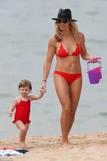 Candice Warner flaunts her toned physique in a TINY bikini a