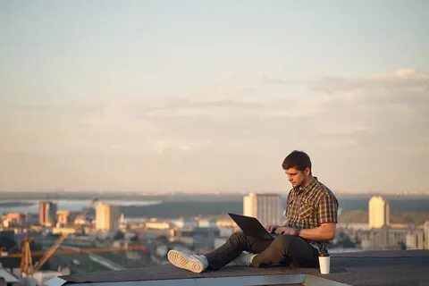 Hipster with laptop on roof on Behance