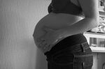 Pregnant belly in profile closeup free image download