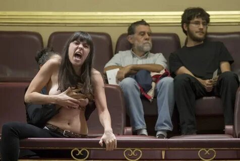 NewsFOC: TOPLESS FEMEN ACTIVISTS STORM SPANISH ANTI-ABORTION RALLY.(NSFW PHOTOS)