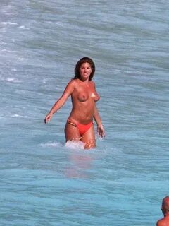 Daisy Fuentes topless in red bikini pants paparazzi shots Ce