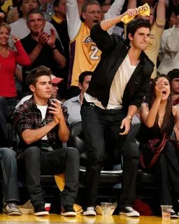 She sits courtside with Zac Efron. - Nina Dobrev's Celebrity