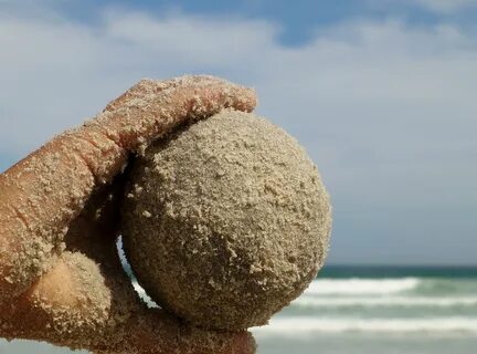 Sand ball in the hand child keep beach free image download