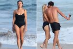 Margot Robbie stuns in a black swimsuit as she passionately 