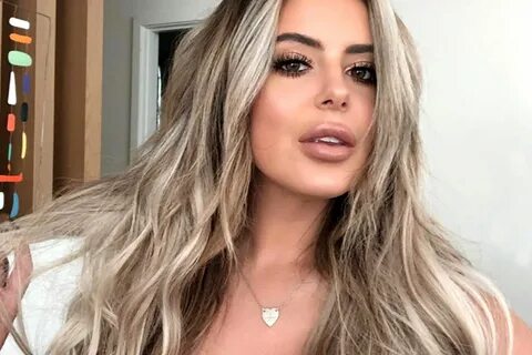 Brielle Biermann Shows Cleavage in Low-Cut Pink Shirt Style 