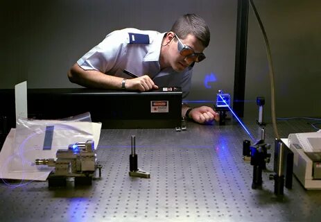 1LT Wiest sets up a laser experiment at the Photonics Labora