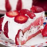 Sweet strawberry cake recipe topped with light whipped cream