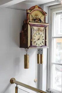 A rare German Black Forest musical organ wall clock with bir