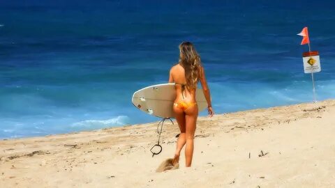 Surfer girl on the beach
