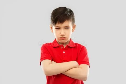 Displeased Boy in T-shirt Pouting and Squinting Stock Image 