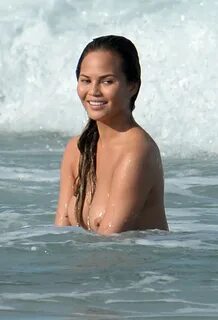 Chrissy Teigen Poses Nude in Sexy Beach Shoot (39 photos) .