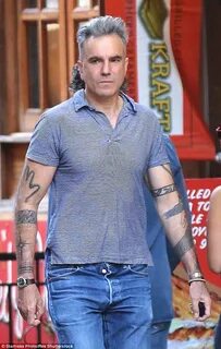 Silver fox Daniel Day-Lewis bares his tattooed sleeves on NY