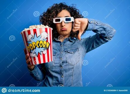 Young Beautiful Curly Arab Woman Watching Movie Using 3d Gla