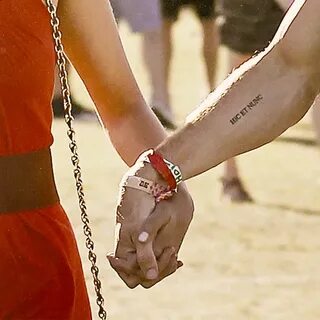 ian somerhalder and nina dobrev. (ians tattoo is in latin...