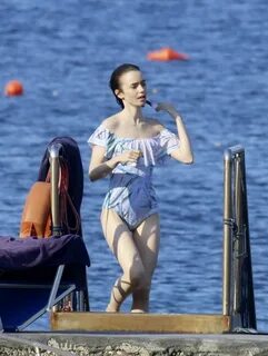 LILY COLLINS in Swimsuit at a Beach in Ischia 07/18/2017 - H