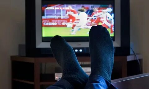 A nation of telly addicts: Average Briton now spends four ho