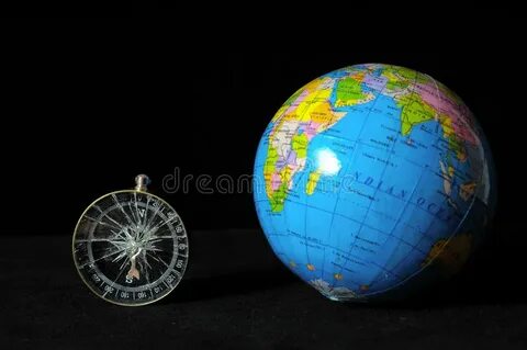 Земля и компас планеты стоковое изображение. изображение нас