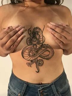 Dragon boob tattoo