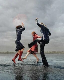 Three Women Having Fun In Rain by Matthias Clamer