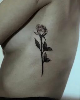 Black ink rose on rib cage Cage tattoos, Small tattoos, Cool