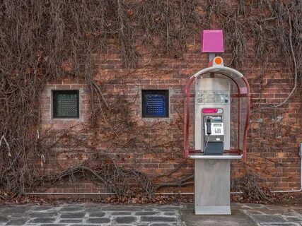 Payphone on brick wall background free image download