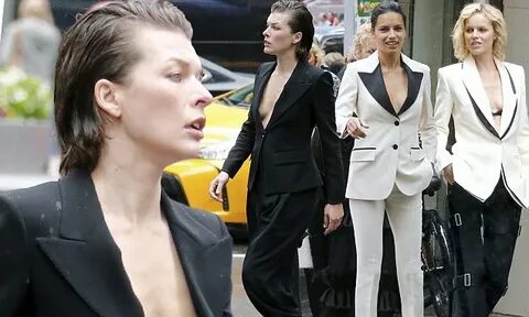 Milla Jovovich suffers a nip slip at star-studded Vogue shoo