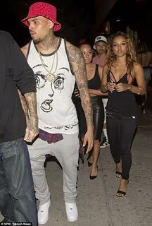 Chris Brown cosies up to mystery lady following split from K