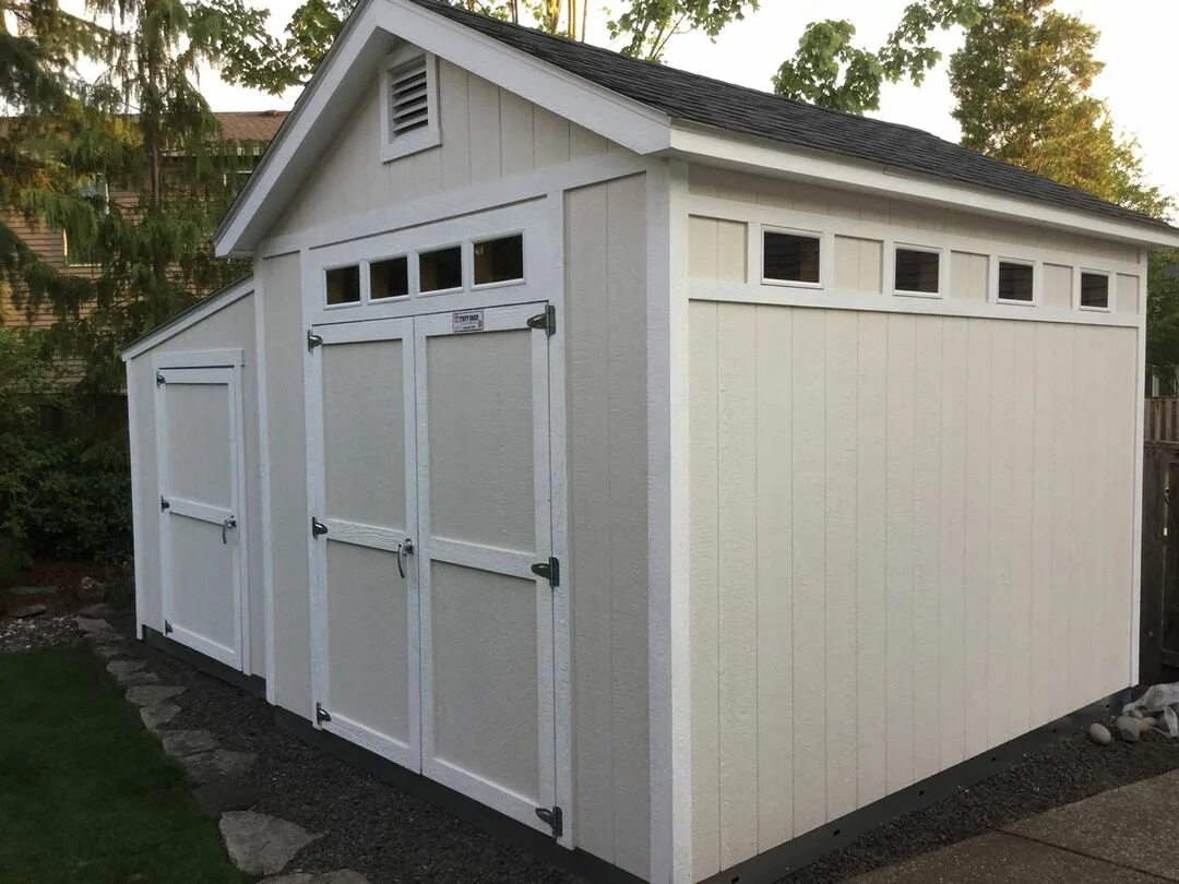 This 10x12 Premier PRO Tall Ranch is partnered with an 8x12 Premier Lean-To...