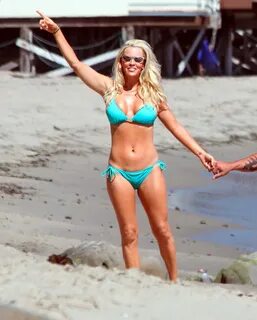 Jenny McCarthy busty wearing sky blue bikini on Miami Beach