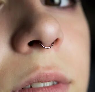 Japanese girl septum rings closeup